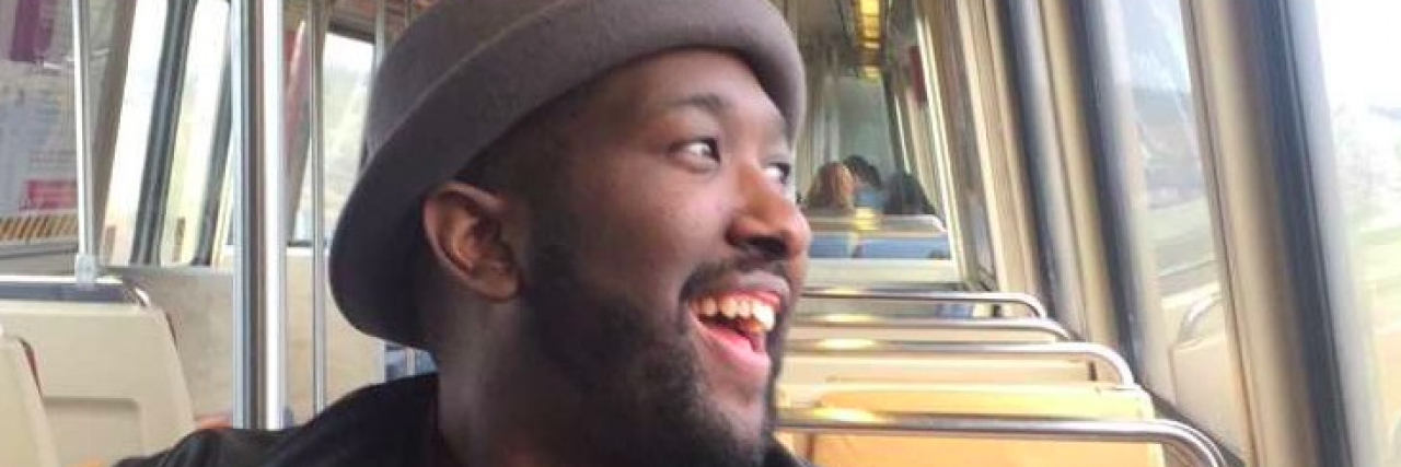 Little Things You Can Do for Friends With Chronic Illness Black man looking out window of train