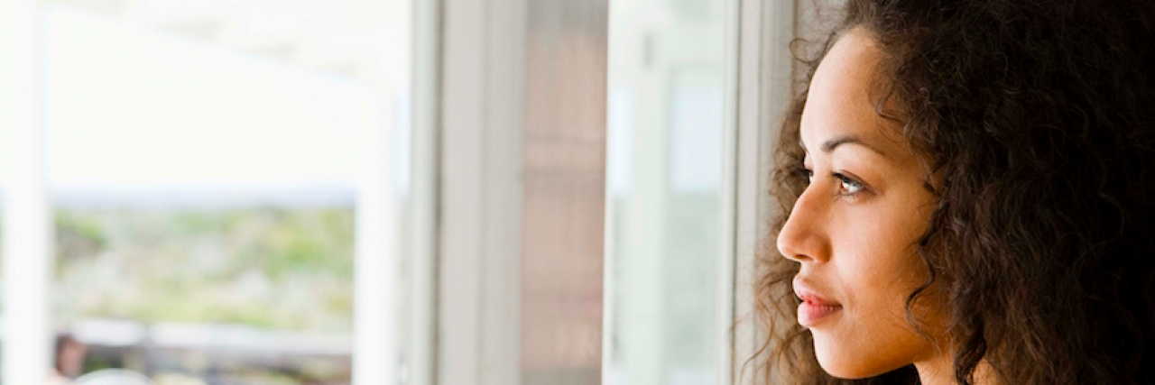 Multiple Sclerosis: Why Not to Say 'But You Look So Good' About My Chronic Illness Woman of color looking out window