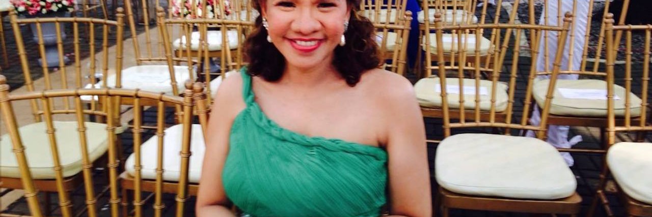 Maja smiling in a formal dress