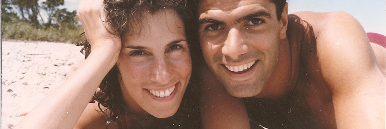 Losing My Boyfriend to Suicide: 11 Lessons on Grief The author and her late partner laying down at the beach