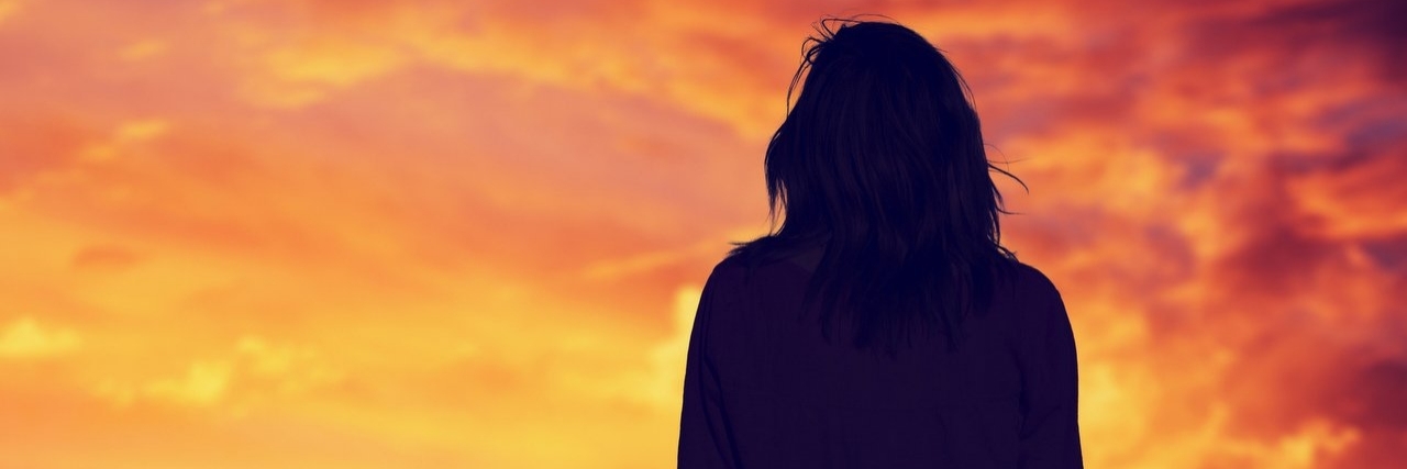 Things I Cherish as a Person With a Chronic Illness woman looking at sunset