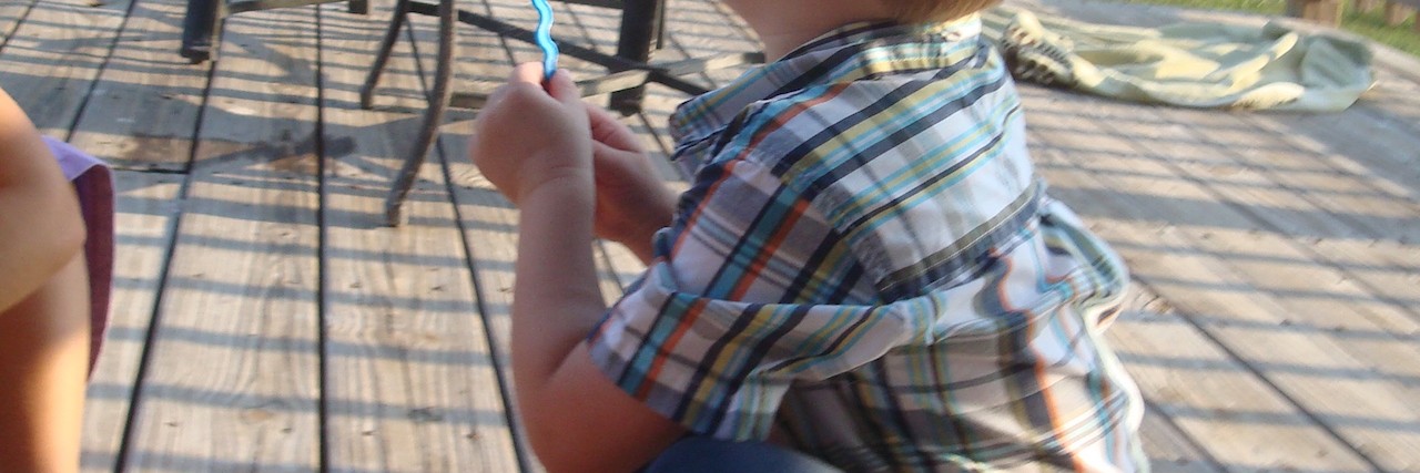 The Benefits of Therapy for Childhood Apraxia of Speech susanne's son blowing bubbles