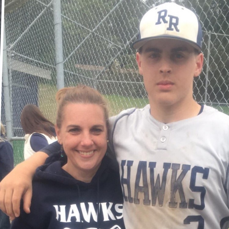 Erin with her son at a baseball game