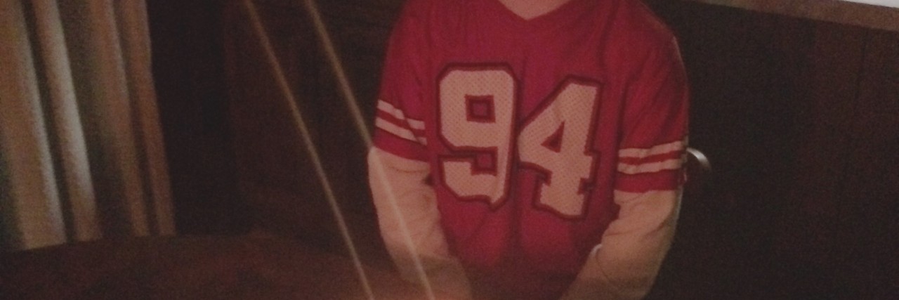 Letter to Those Who Think People With Down Syndrome Are Always Happy The author's brother sitting in front of a birthday cake