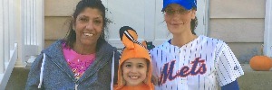 Nicole's mother, her son, and Nicole in a baseball cap.