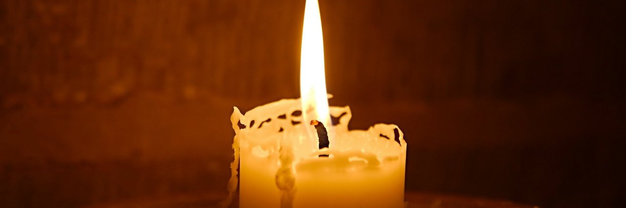 Helping My Brother With Autism Cope With Death and Grief candle on fire