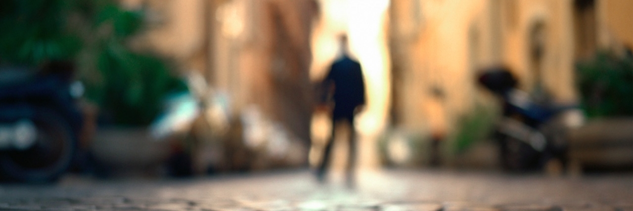 Talking About Psychosis as a Symptom of Bipolar Disorder blurry man in the street