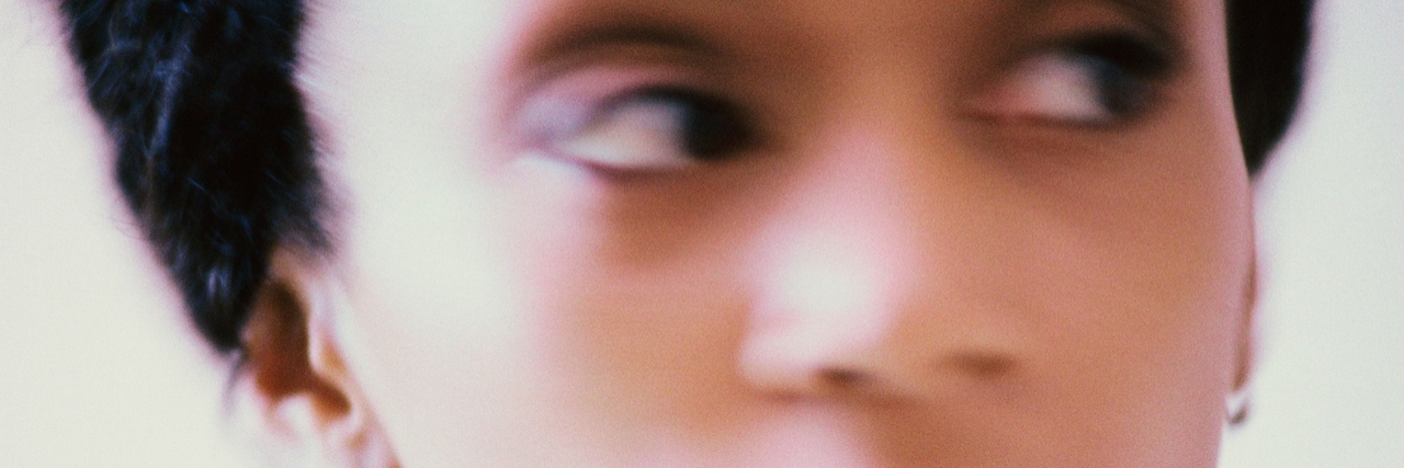 What It's Like to Have ADHD and Bipolar Disorder as an Adult Woman portrait of a blurred young woman