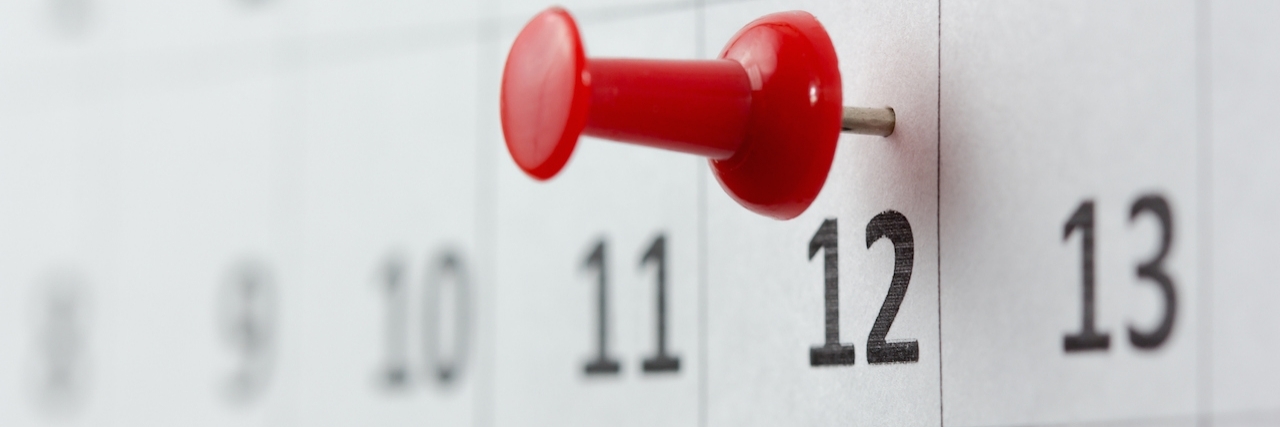 Mental Health Awareness Shouldn't End in May calendar with a red push pin