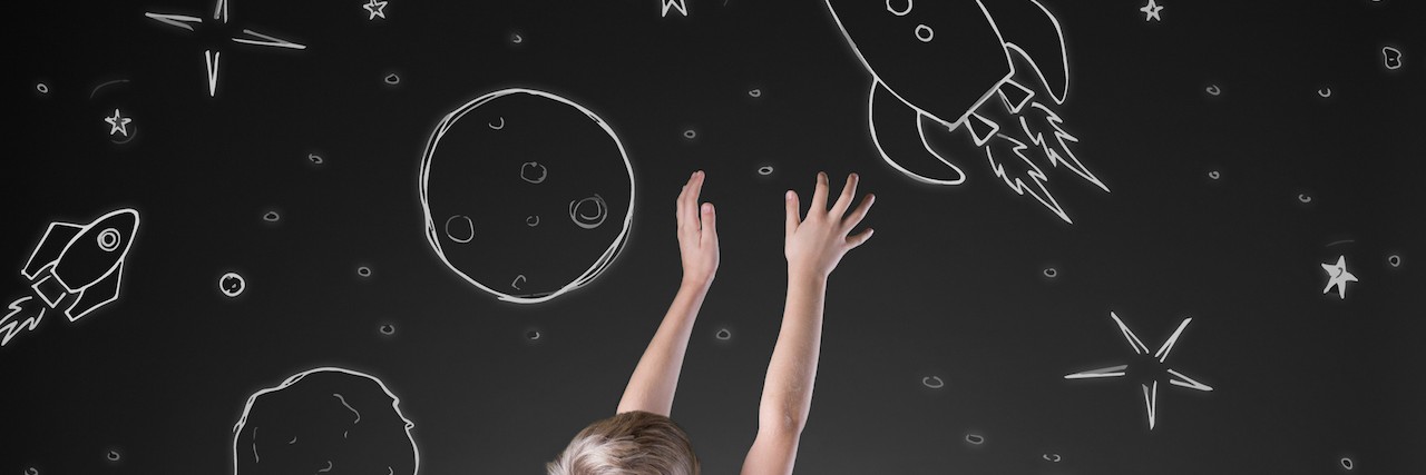 What It's Like to Parent a Child With Anxiety Little boy reaching for rocket in drawn space