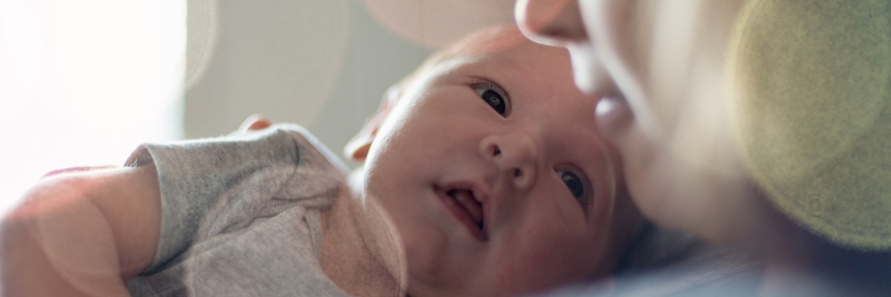 What It Looks Like to Recover From Postpartum Depression baby boy and mother looking at each other tenderly