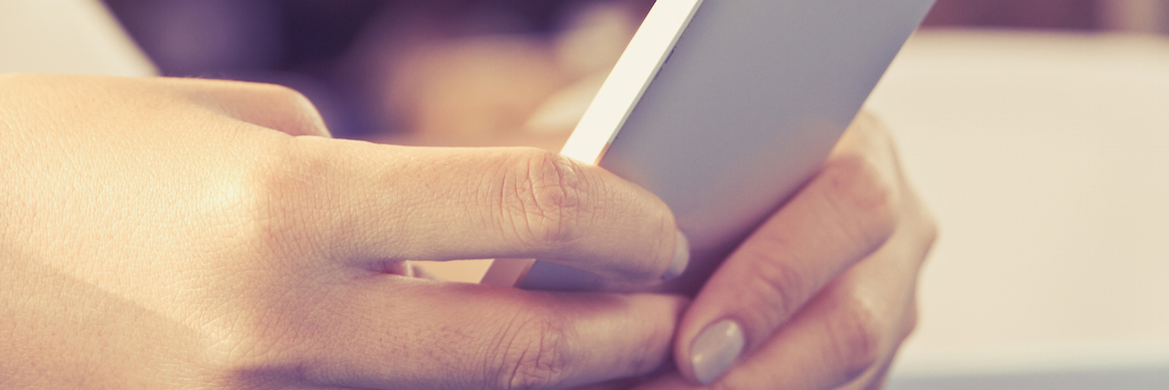 To My Social Media Friends, From a Woman With Schizophrenia Close-up of hands using a phone with blurred background