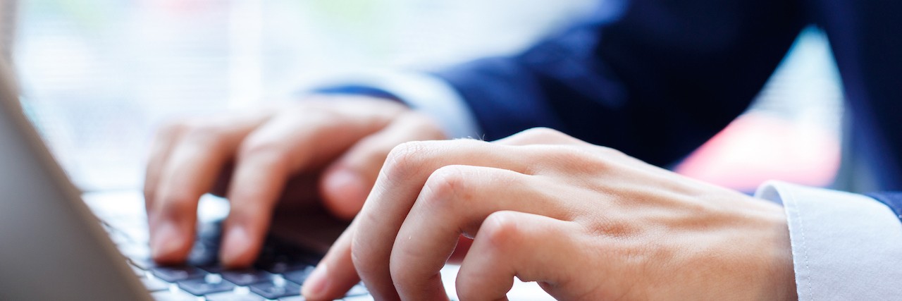 Letter to Friends From Person With Migraine About Internet Cure Claims close up view of businessman typing on laptop indoors