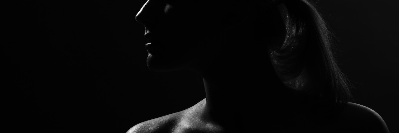young woman in the dark
