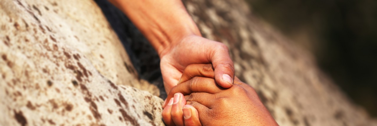 How To Support a Loved One With Traumatic Brain Injury Hand holding.