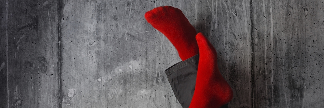 Finding Purpose From My Psych Ward Stay for Anxiety and Depression Legs up the wall, putting feet up