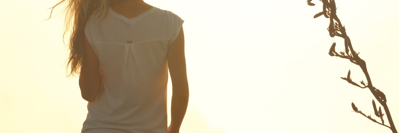 Being Judged for Short Bowel Syndrome Within Chronic Disease Community woman looking at sunset