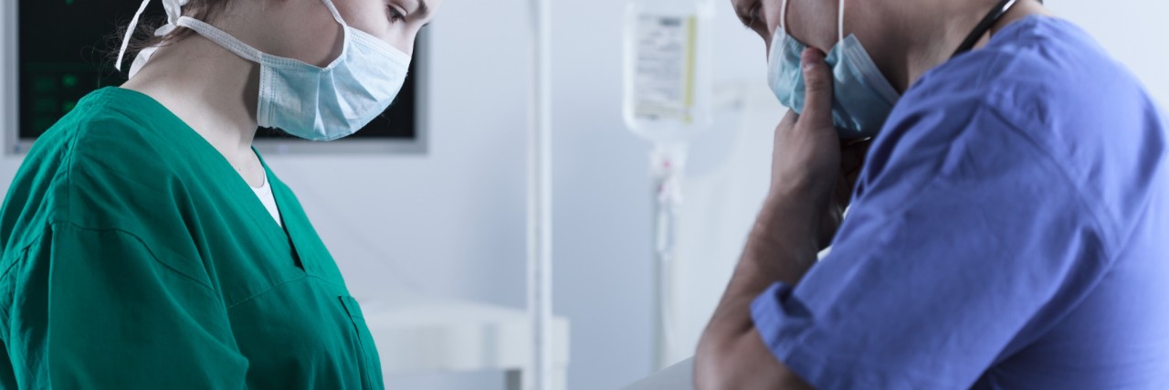 Mom Thanks PICU Doctor for Mistake During Son's Seizure two doctors looking worried