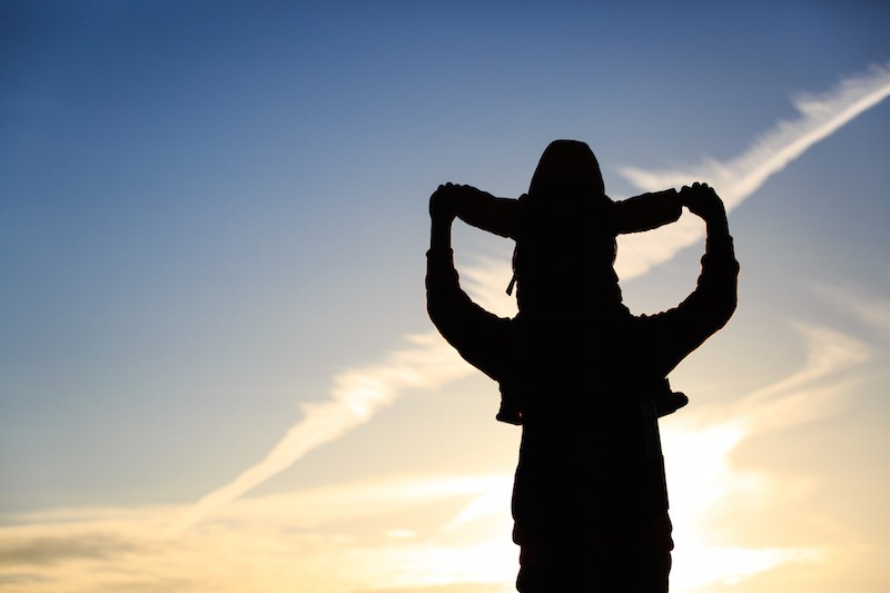 What I Fight for as the Parent of a Child With Life-Limiting Illness silhouette of father and little daughter on shoulders at sunset