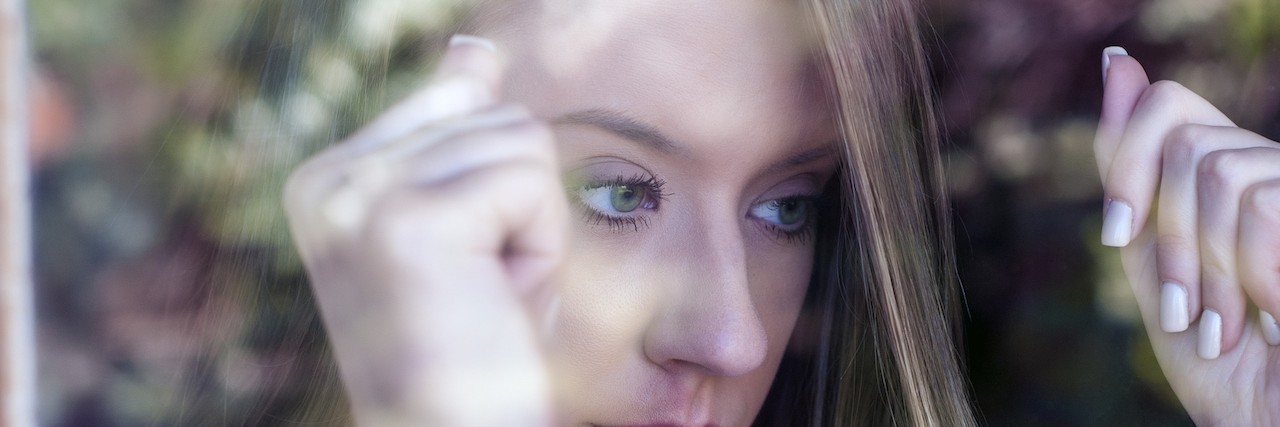 Life Is Unfair but That Doesn't Make It Bad melancholy and sad young woman at the window