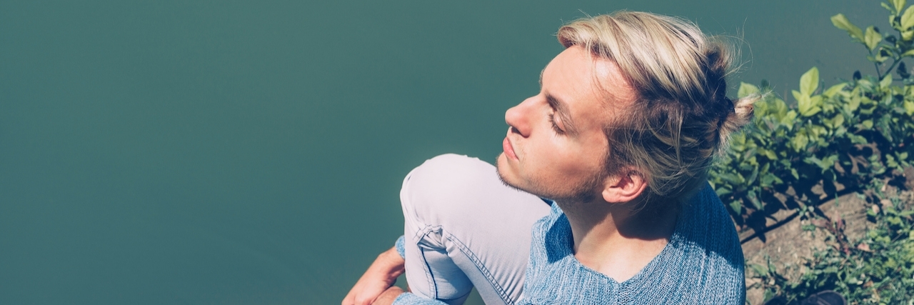 Positive Self-Talk to Help Cope With Depression Good looking blonde young man outdoors in nature