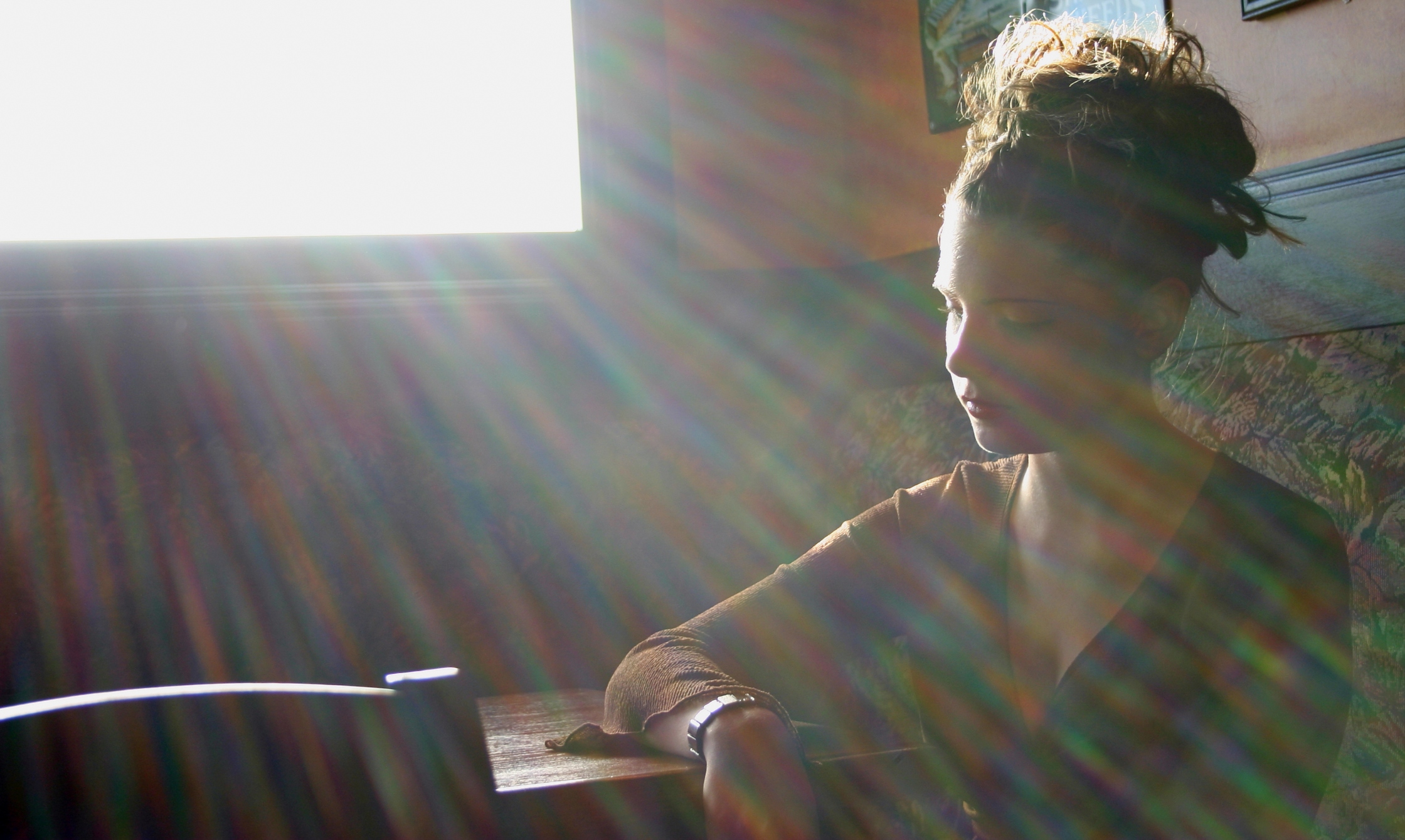 How Ehlers-Danlos Syndrome Affects Anxiety and Depression Woman sits alone with sun coming in window
