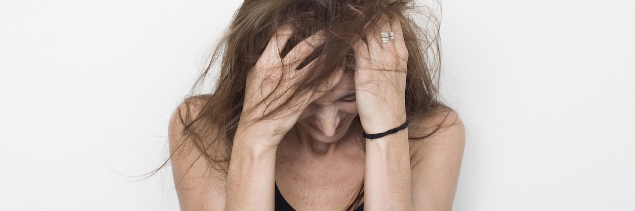 Hiding Symptoms of ADHD and Bipolar Disorder Embarrassed woman