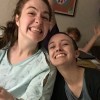 two friends smiling at hospital