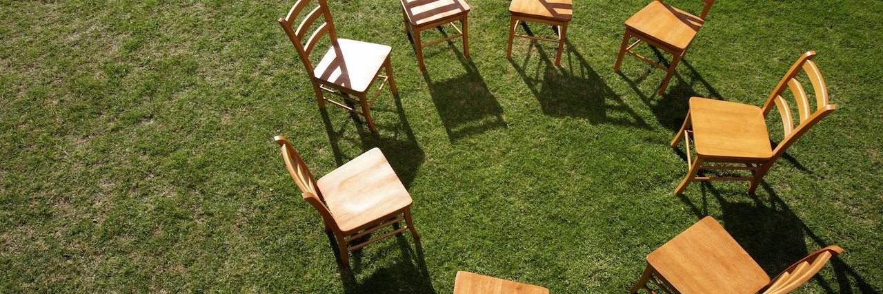 Chairs on lawn forming circle, elevated view