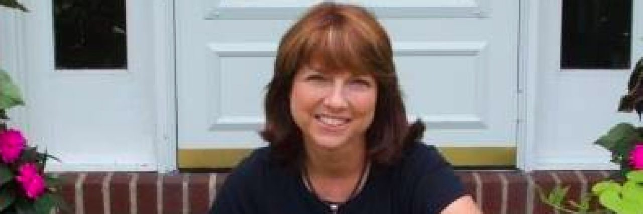 Letter to Parents of Kids With Diabetes and Ehlers-Danlos Syndrome woman sitting on steps with collie dog