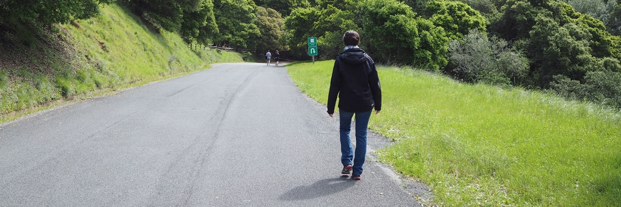 Ehlers-Danlos Syndrome and Finding Understanding Doctors Karina walking down a road.