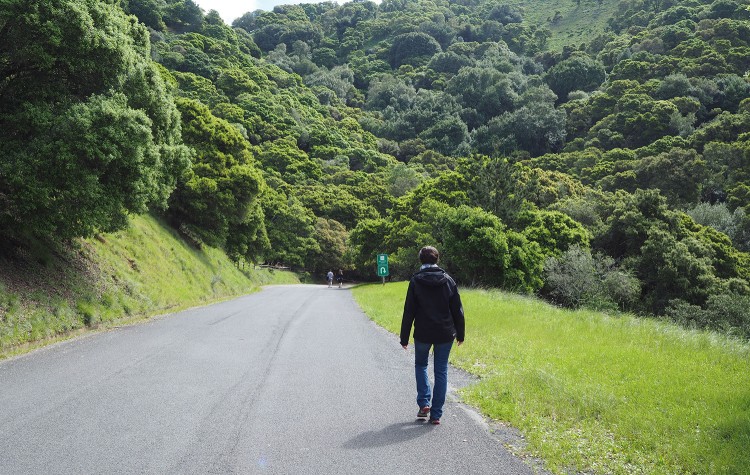 Karina walking down a road.