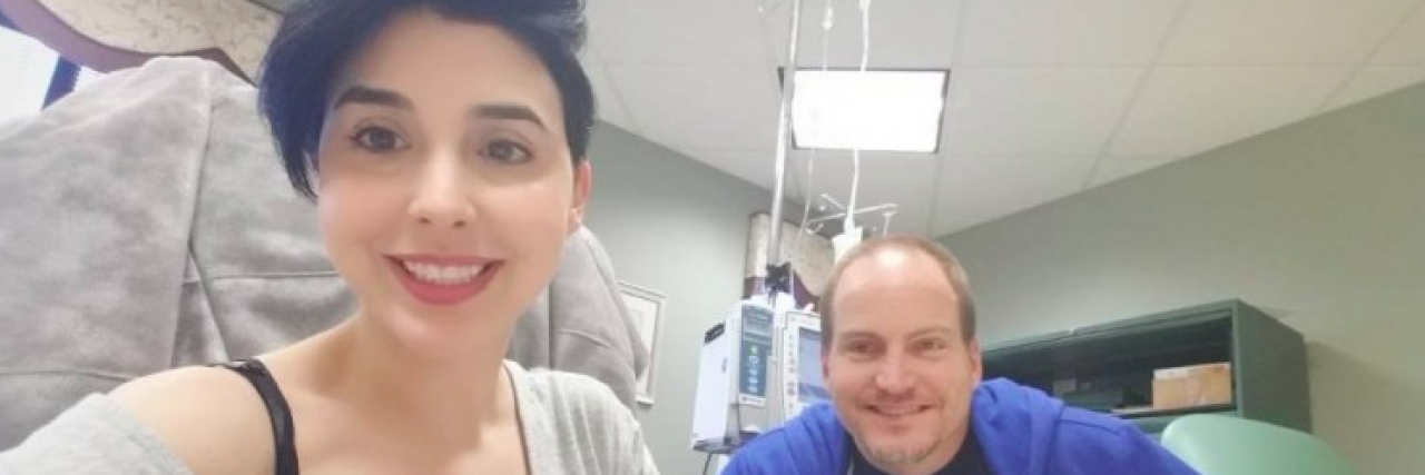 Contributor, a white woman with short dark hair, getting treatment at doctor with husband