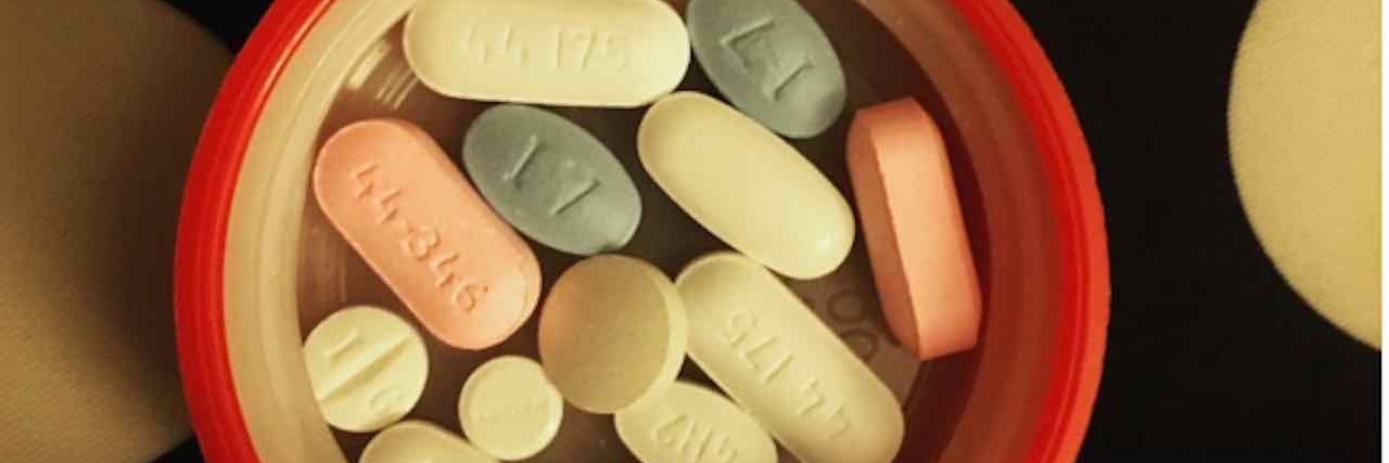 Dealing With People Judging My Rheumatoid Arthritis Medicine pills in a container