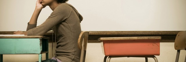 Student sitting at a desk in a classroom
