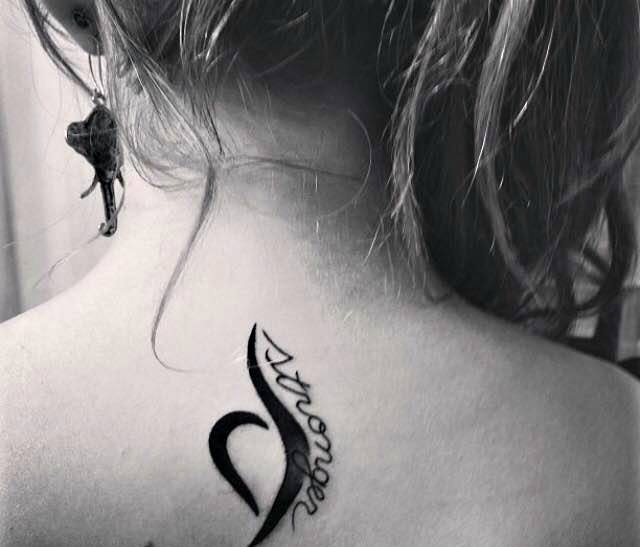 tattoo reads "stronger" with eating disorder recovery symbol