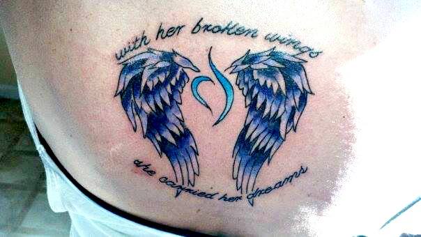 Tattoos says: With her broken wings she carried her dreams.