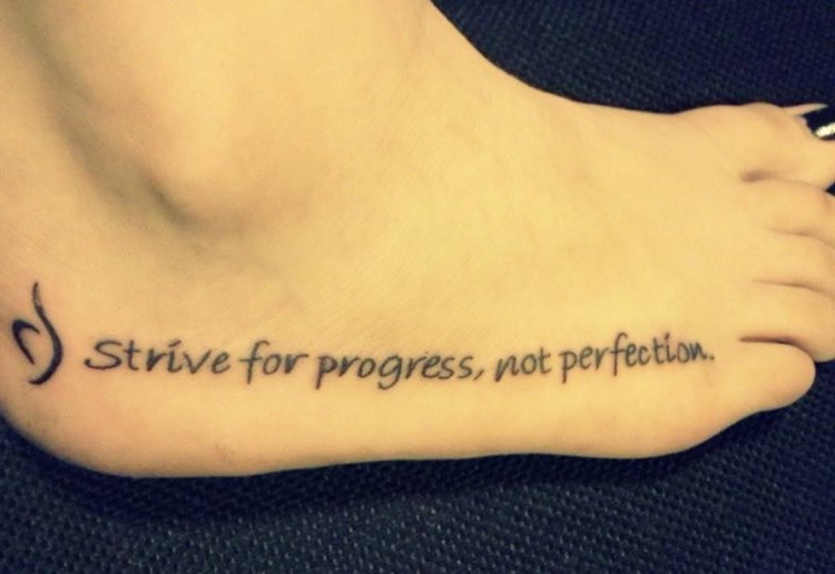 Tattoo says, strive for progress, not perfection