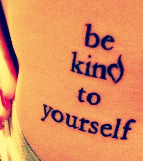Tattoo reads: Be kind to yourself.