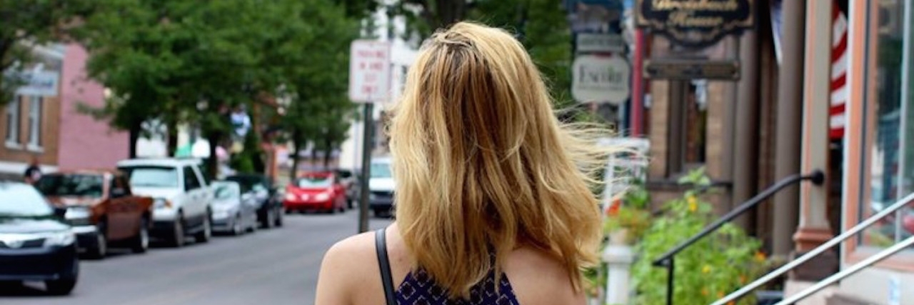 Letter to Doctor Who Doesn't Believe Depression The back of a woman's head standing on a side walk