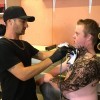 young man gets a tattoo