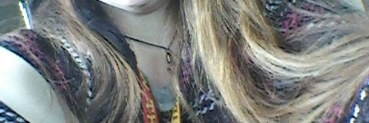 Pulling Out My Eyebrows: Trichotillomania Taught Me Acceptance young woman who's pulled out her eyebrows