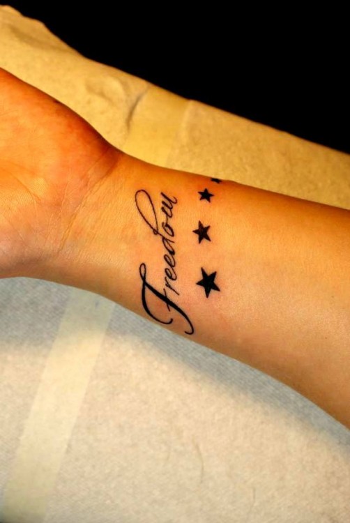 Tattoo reads "Freedom"