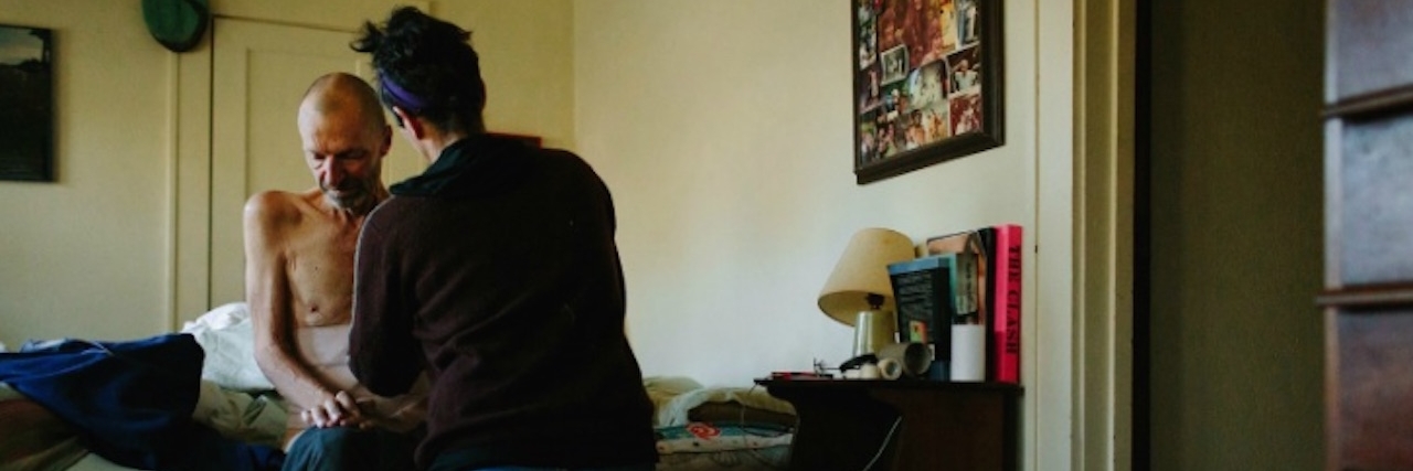 Receiving an ALS Diagnosis: A Photo Story Rae helping Ray get dressed in the morning