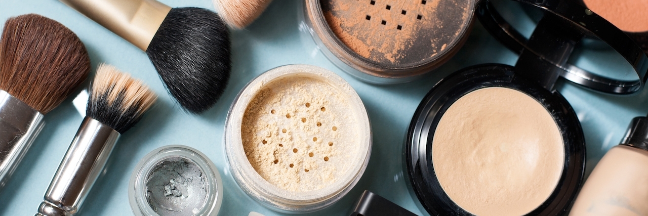 Using Makeup to Help Cope With Depression makeup spread out on a counter