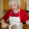 In a photo provided by Elise Sampson, Carolyn Sampson measures flour for Reason to Bake cookies.