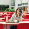 Frustrated woman sitting at lunch table