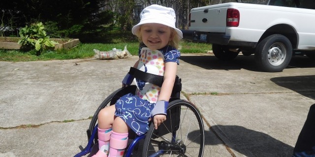 A Letter to Myself After My Daughter's Terminal Diagnosis Heidi in her wheelchair smiling