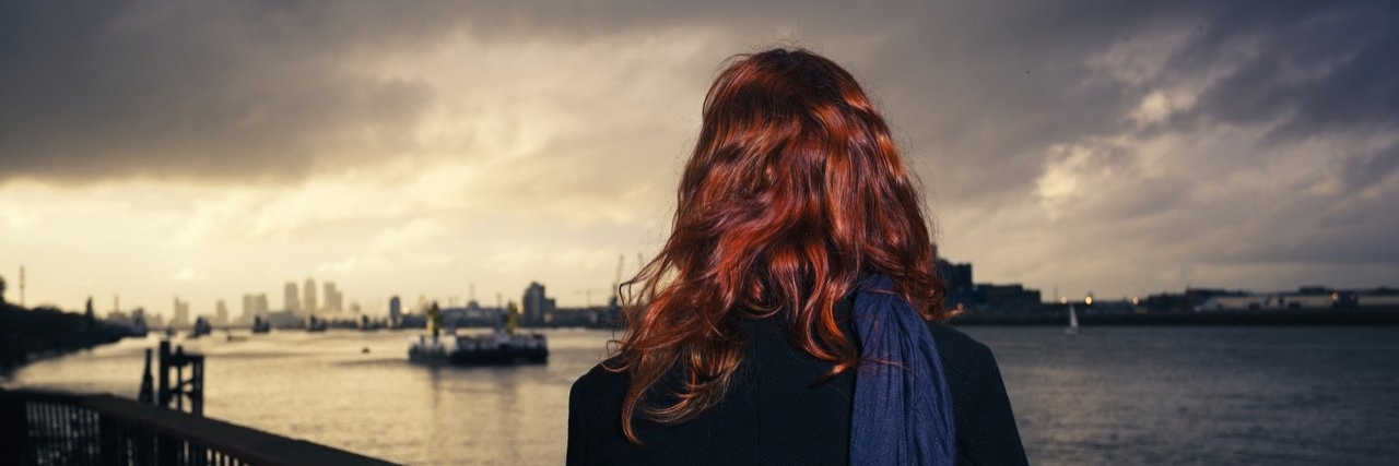 Child Loss: The Phrase ‘Time Heals All Wounds’ Hurts to Hear woman looking at river