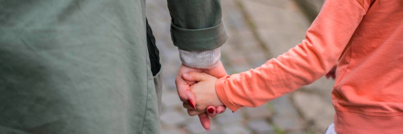 Mother and daughter walking together